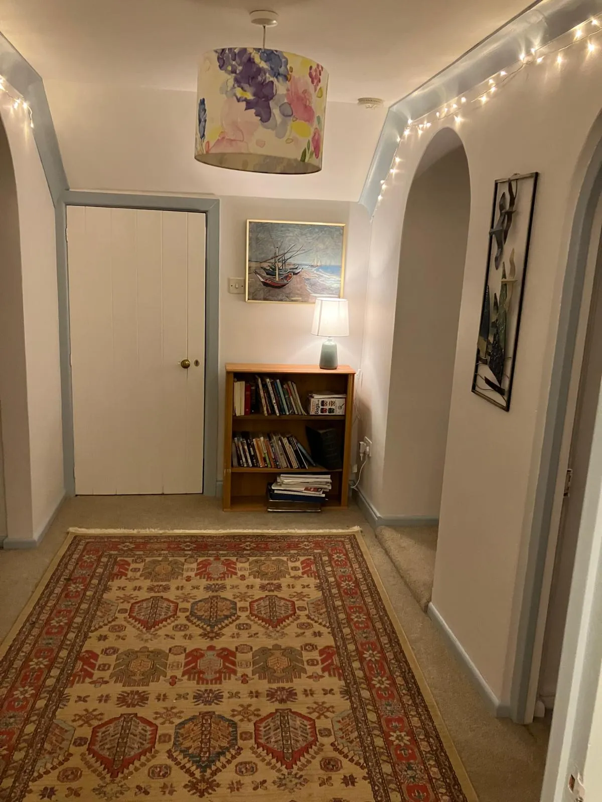 Hallway with bookcase and games